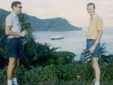 Yours truly and Des Hudson on road above Kieta with the Royal Yacht at anchor