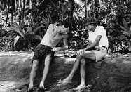 Playing chess with Noel on Wewak's black-sand beach